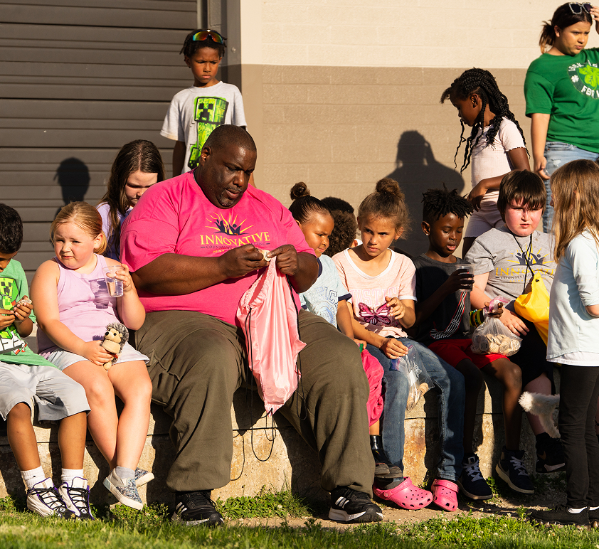Community members sitting together outdoors