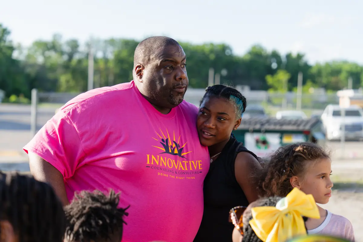 Staff member with youth outdoors