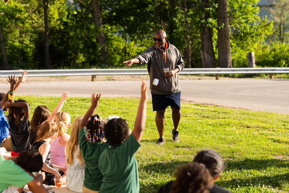 Youth posing and pointing at the camera