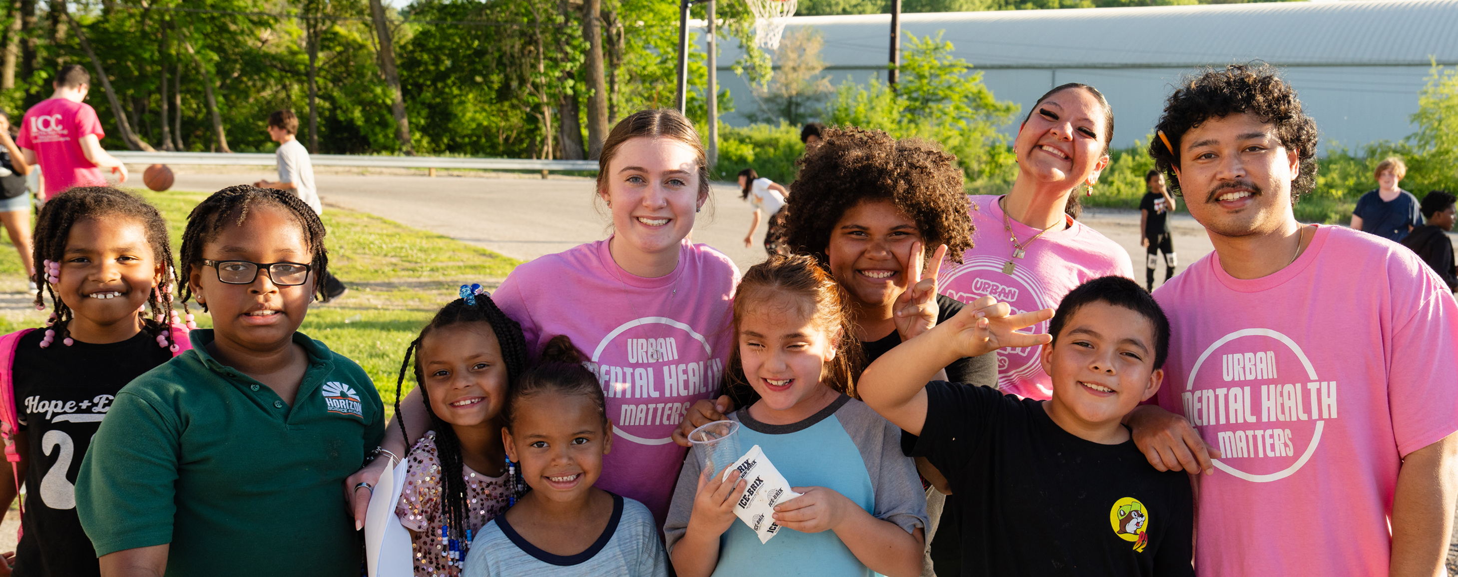 Diverse group of smiling children and adults