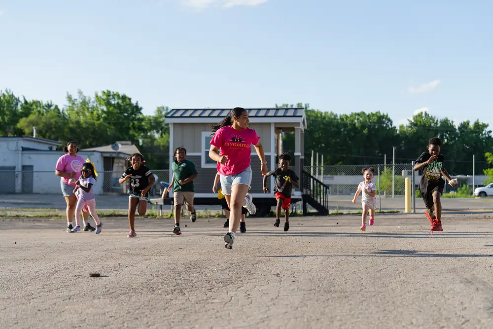 Kids running at a community event