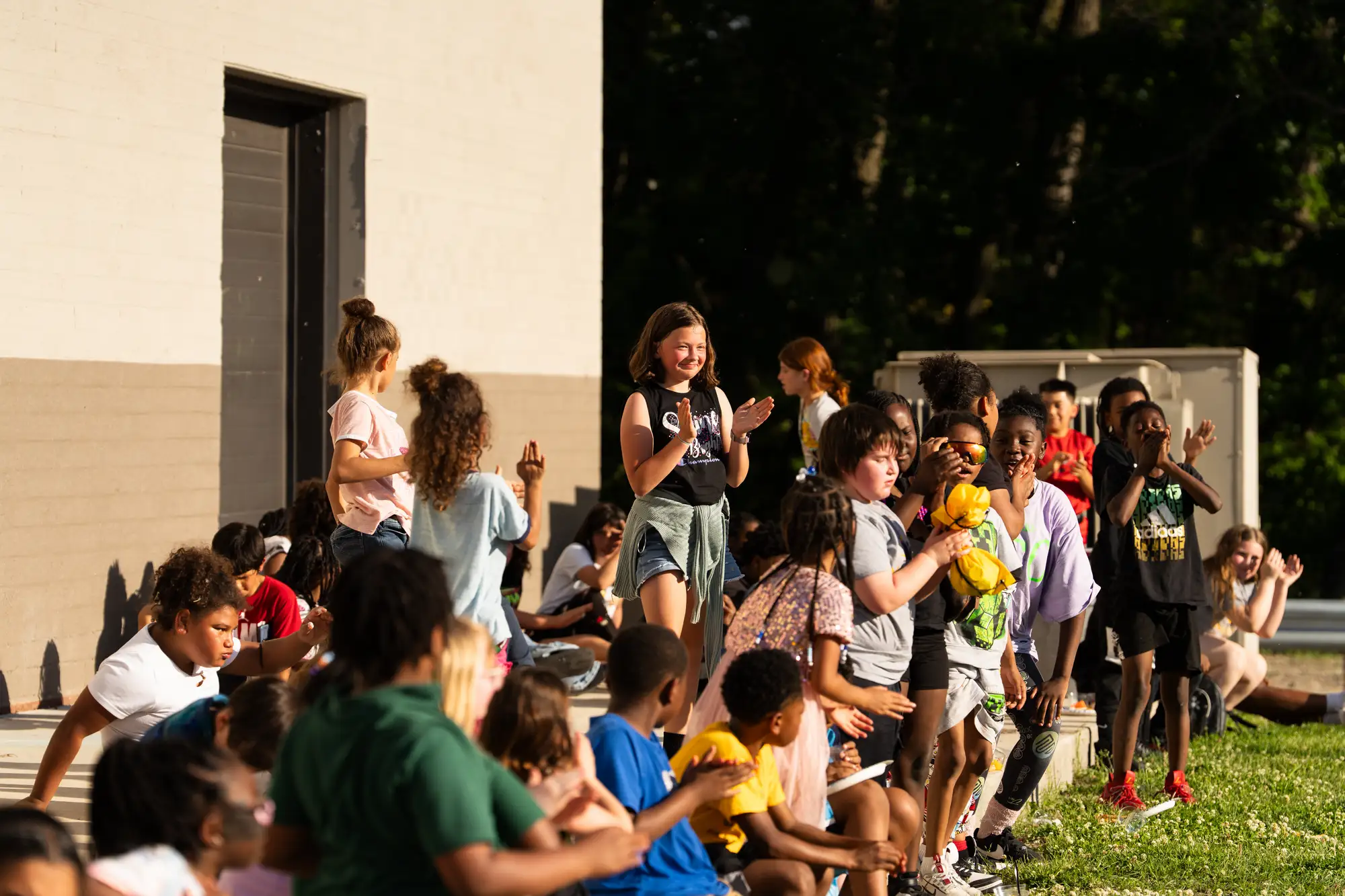 Children clapping at a group activity