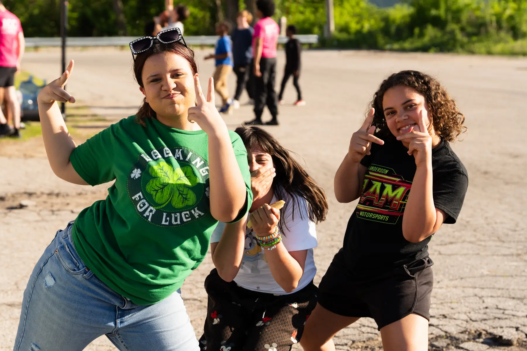 Children smiling and making peace signs