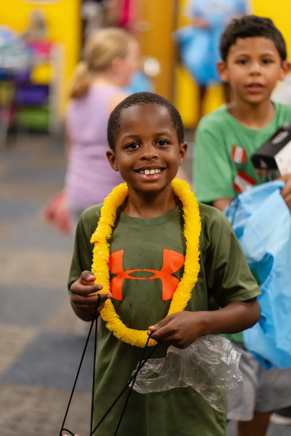 Child smiling at a community program